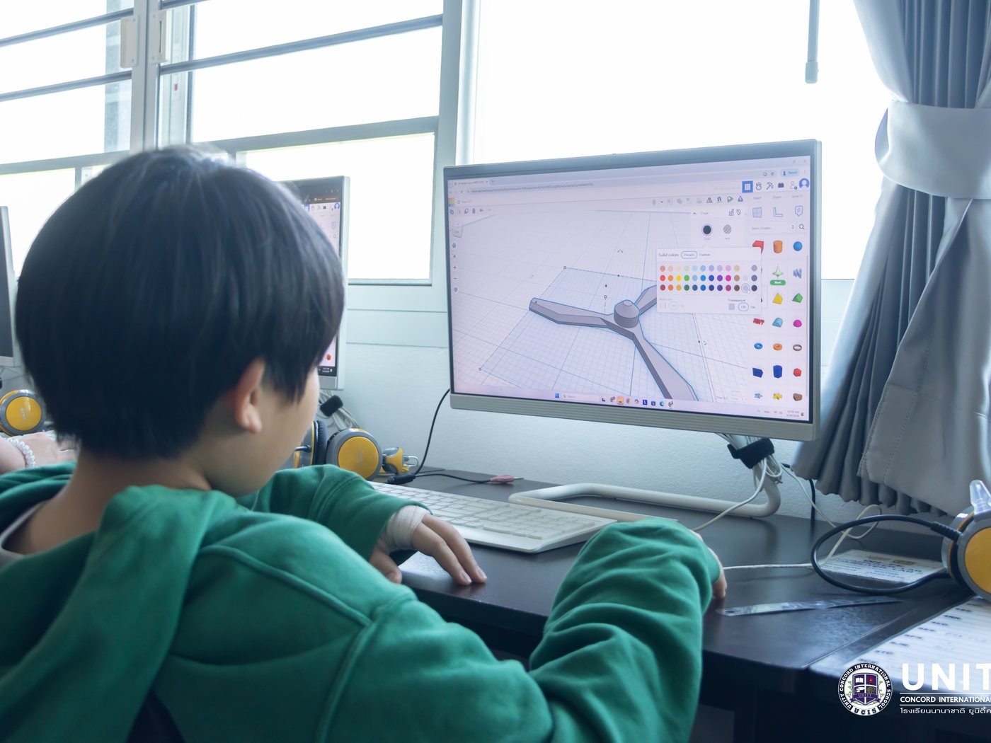 Student designing a wind turbine piece in Tinkercad during the 3D CAD design phase