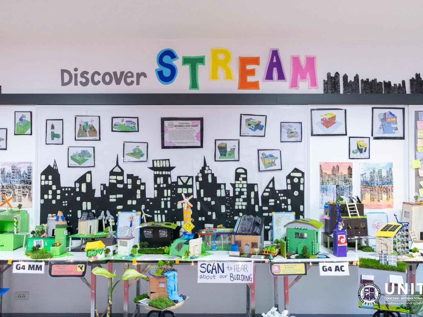 The full Discover STREAM display of every group's green building model forming a sustainable city skyline