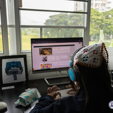 Student building her Google Sites showcase page