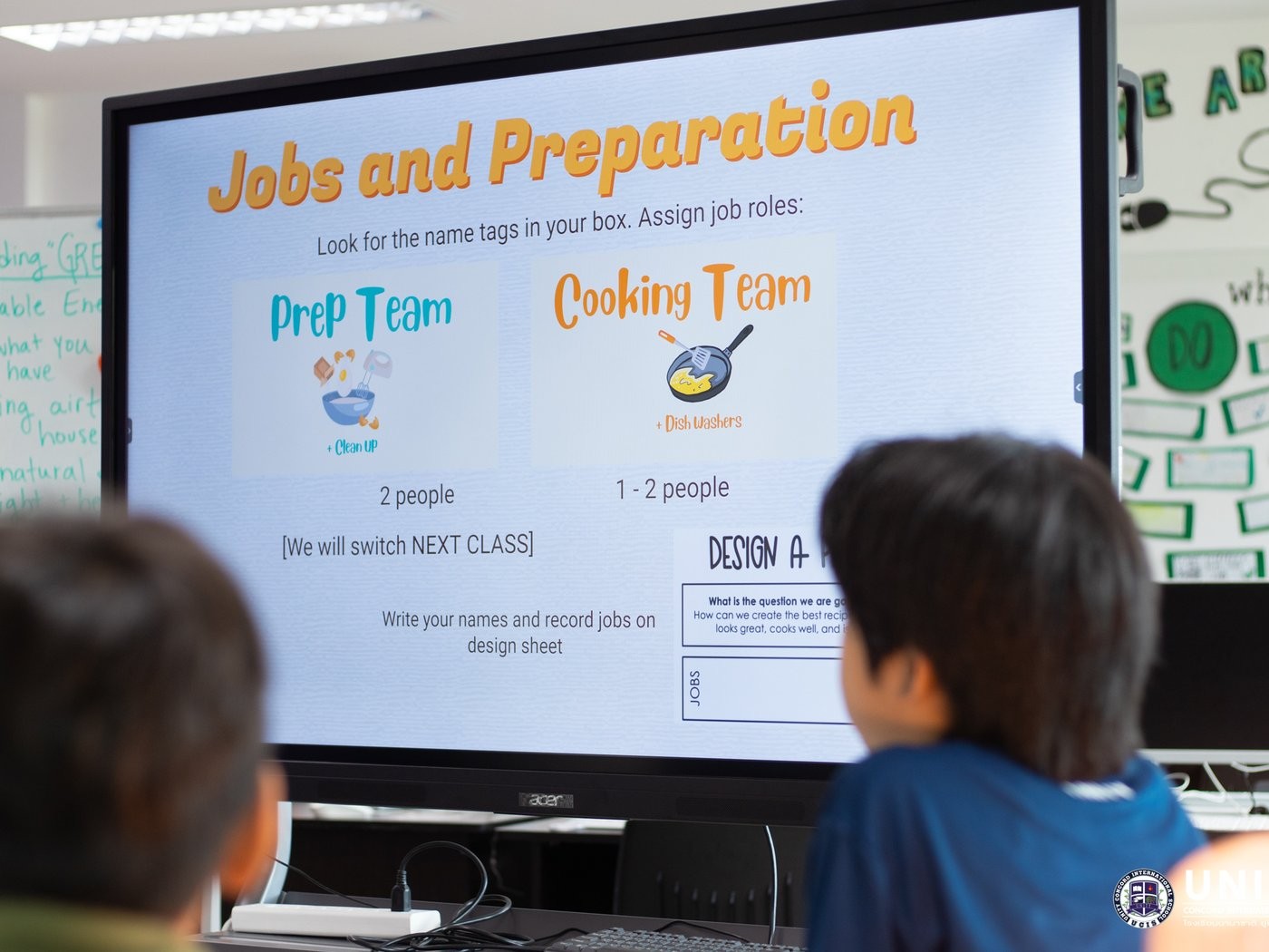 Smartboard slide assigning Prep Team and Cooking Team job roles for the pancake cook-off