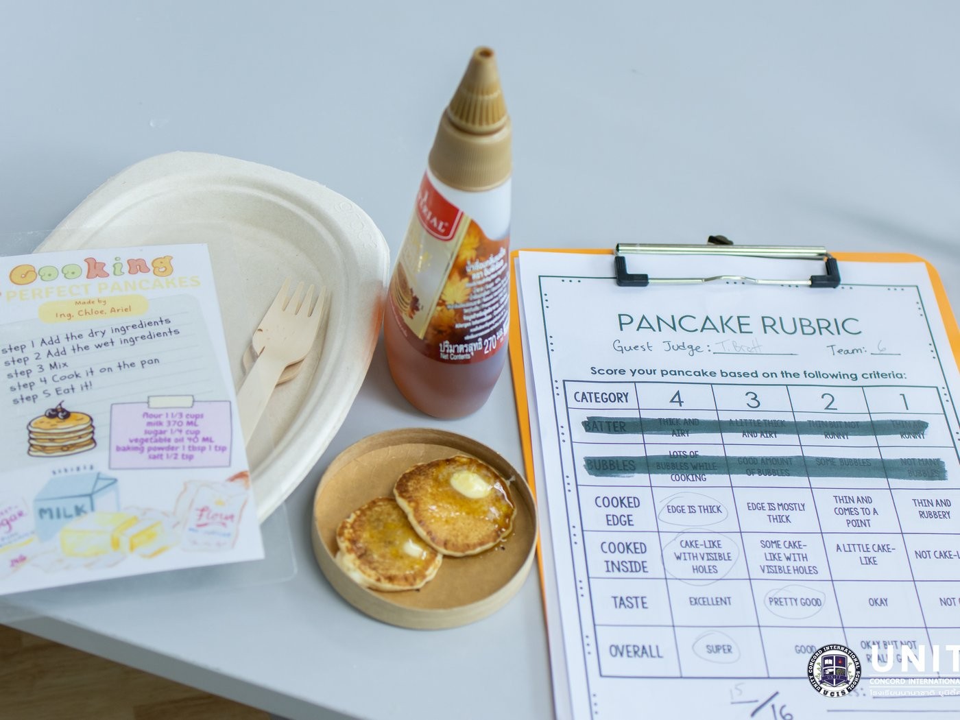 Finished pancakes, a recipe card, and a scored Pancake Rubric from a guest judge