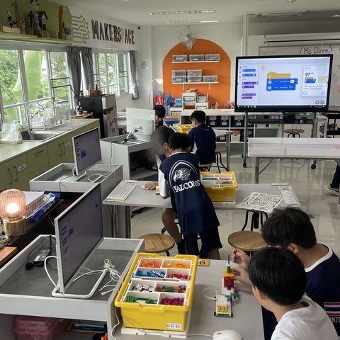 Students building LEGO SPIKE robots in the makerspace